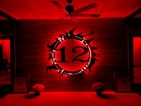 12 Fires Winery logo on tasting room wall