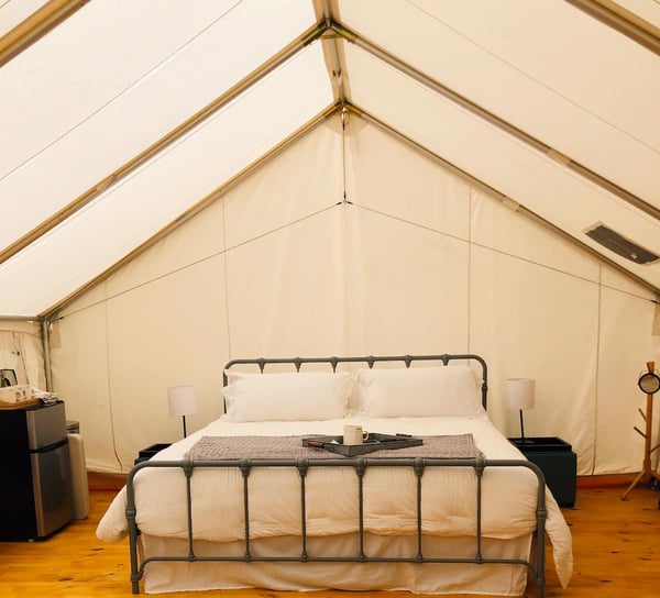 Tent interior with large bed