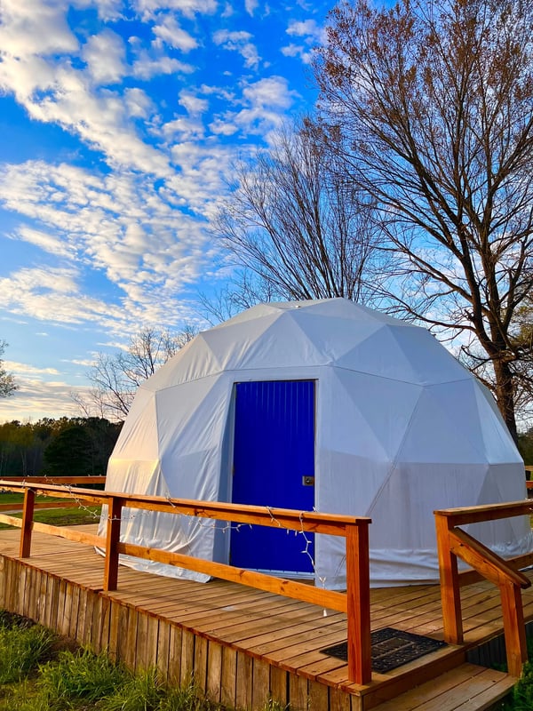 Glamping dome with blue skies in the background at glamping remote