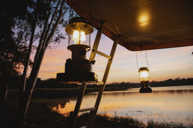 hanging lamps at dusk near pond